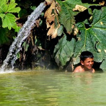 Boy enjoying the warm water of the Termas del Cañon